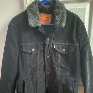 Levi’s black corduroy Sherpa trucker Jacket.
